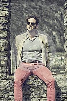 Attractive man outdoor in old European castle