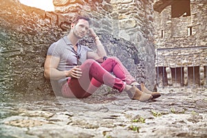 Attractive man outdoor in old European castle