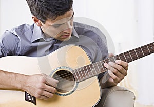 Attractive Man Playing Guitar