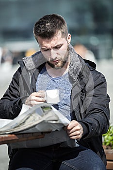 Attractive man is relaxing in a coffee shop