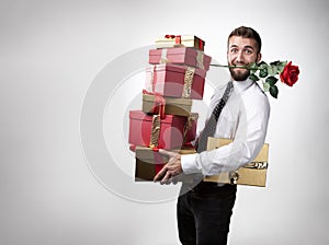 Attractive man with rose in mouth