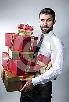 Attractive man with several gift packages