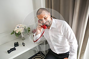Attractive man in shirt talking at phone