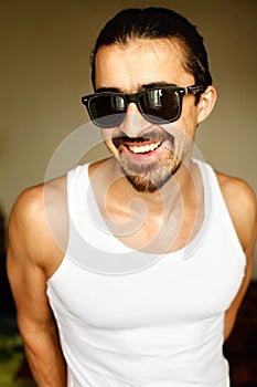 Attractive man smiling wearing sunglasses
