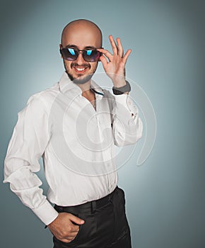 Attractive man in sunglasses smiling