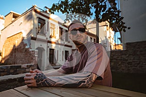 Attractive man tourist near Saint Joseph Orphanage Istanbul Beyoglu. Ancient building under construction.