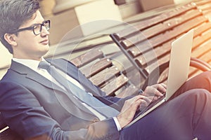 Attractive man using laptop