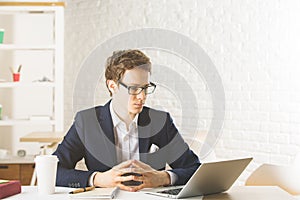 Attractive man using laptop