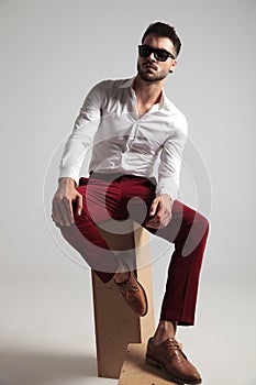 Attractive man wearing unbuttoned shirt poses
