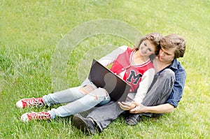 Attractive man and woman with laptop