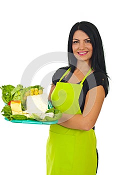 Attractive market worker holding cheese photo