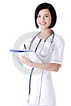 Attractive medicine student or doctor with notebook