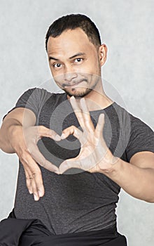 Attractive men are in love with heart-shaped hands