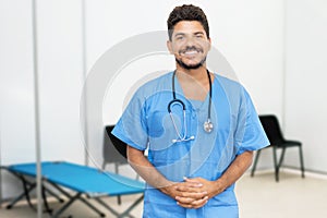 Attractive mexican male doctor is ready for vaccinating patients