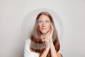 Attractive mid adult woman on white background, portrait