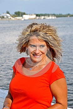 Attractive Middle Age Woman Wearing a Red Top