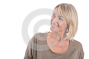 Attractive middle aged blond woman looking sideways to text.