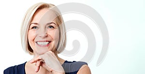 Attractive middle aged woman with beautiful smile on white background