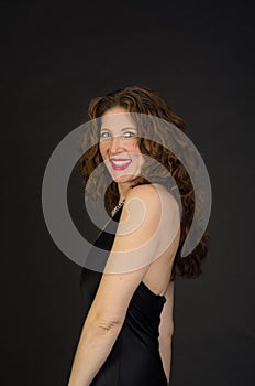 Attractive middle aged woman in black dress