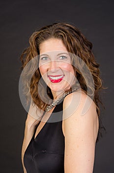 Attractive middle aged woman in black dress