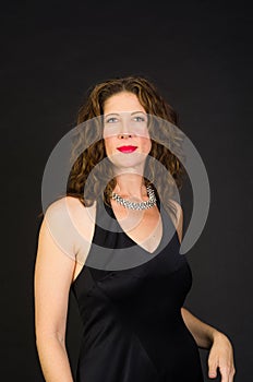 Attractive middle aged woman in black dress