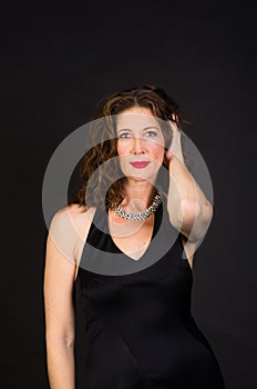 Attractive middle aged woman in black dress