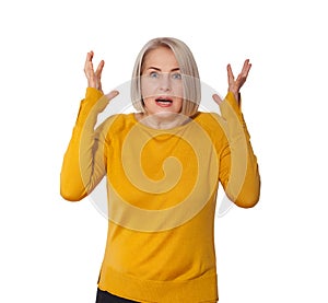 Attractive Middle Aged Woman expresses fear and horror, panic and cry, hysterics and problem, surprise and fright. Woman