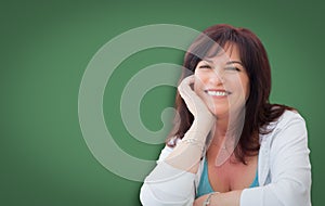 Attractive Middle Aged Woman Portrait In Front of Green Chalkboard