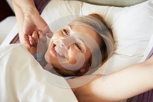 Attractive Middle Aged Woman Waking Up In Bed