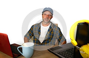 Attractive millennial business man working with laptop computer as internet blogger and technology geek in online successful job a