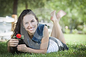 Attractive Mixed Race Teen Girl Portrait Laying in Grass
