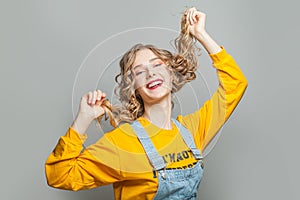 Attractive model girl smiling on gray background