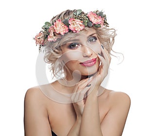 Attractive model with make up and spring flowers. Beautiful blonde isolated on white