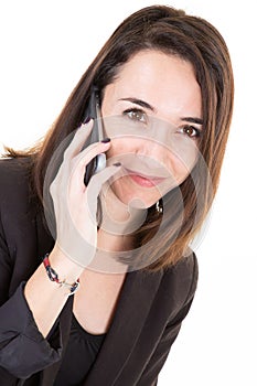 Attractive modern pretty business woman speaks on the phone with a client