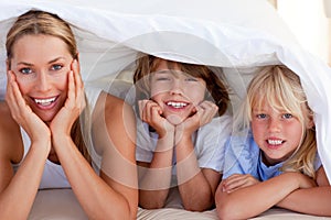 Attractive mother having fun with her children