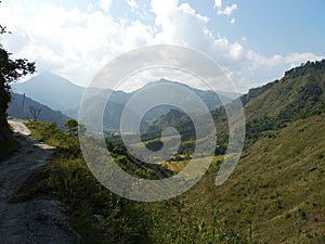attractive mountain range with fog in sky