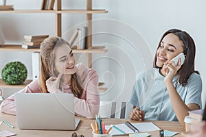 attractive multiethnic students using smartphone