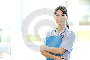 Attractive nurse with clipboard