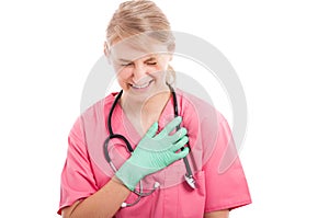 Attractive nurse having heart attack or pain