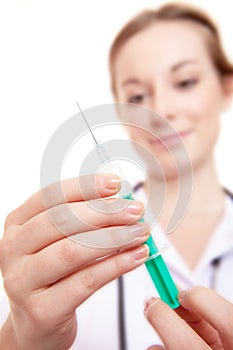 Attractive nurse preparing syringe
