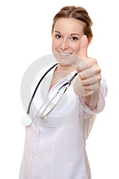Attractive nurse showing thumbs up