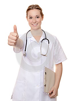 Attractive nurse showing thumbs up