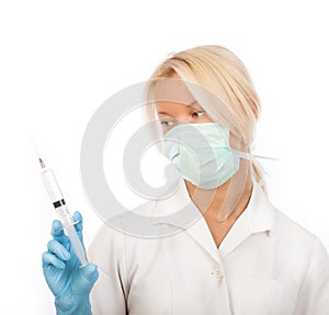 Attractive nurse with syringe in hands