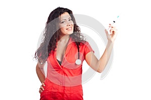 Attractive nurse or woman doctor with syringe