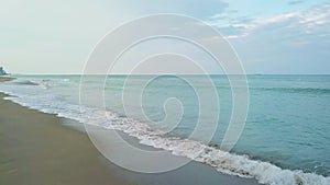 Attractive oceanscape with charming blue waves near clean sandy shore in sunny day in miami,sunny isles beach
