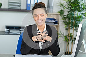 Attractive office worker sitting at desk