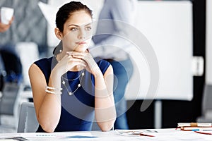 Attractive office worker sitting at desk