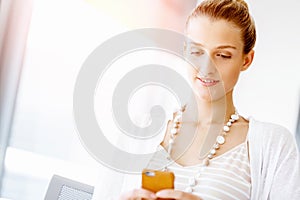 Attractive office worker sitting at desk