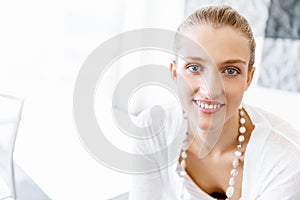 Attractive office worker sitting at desk