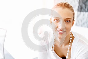 Attractive office worker sitting at desk